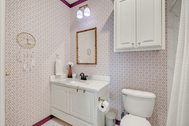 801 Keystone Ct, Midland, TX 79705 - bathroom featuring vanity, toilet, and wallpapered walls