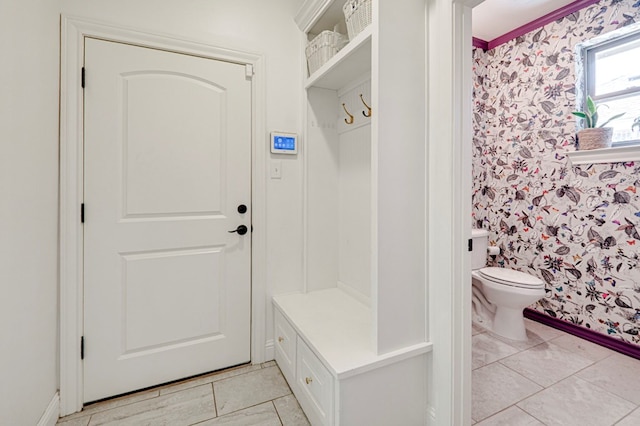 801 Keystone Ct, Midland, TX 79705 - mudroom with wallpapered walls, light tile patterned floors, and baseboards