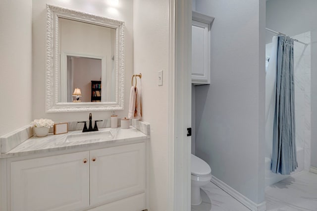 801 Keystone Ct, Midland, TX 79705 - bathroom featuring marble look tile flooring, vanity, and toilet