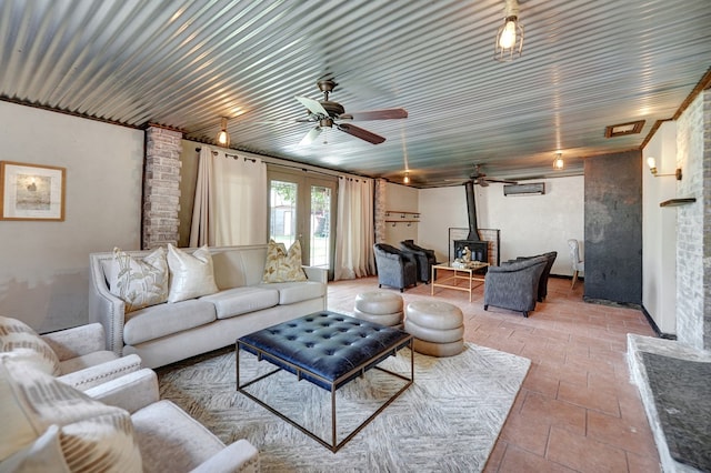2202 Princeton Ave, Midland, TX 79701 - living area featuring a wood stove and a ceiling fan