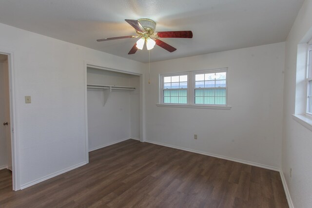 unfurnished bedroom with a closet, ceiling fan, and dark hardwood / wood-style flooring