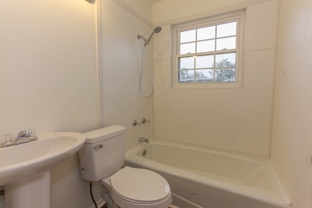 full bathroom with sink, toilet, and shower / washtub combination