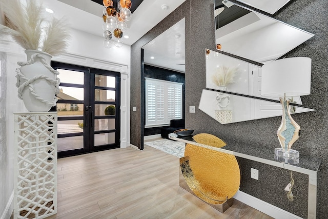 foyer entrance featuring recessed lighting, french doors, and wood finished floors