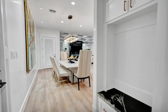 dining space with light wood finished floors, baseboards, visible vents, a chandelier, and recessed lighting