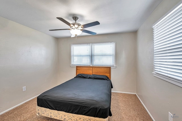 bedroom featuring carpet flooring, a ceiling fan, and baseboards