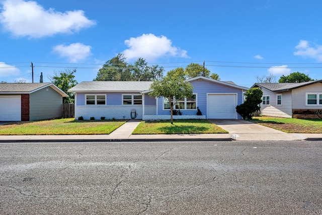 ranch-style house featuring fence, a front yard, brick siding, concrete driveway, and an attached garage