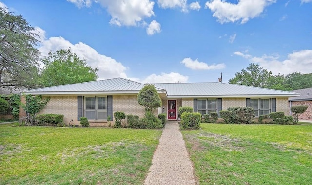 4107 Crestgate Ave, Midland, TX 79707 - ranch-style home with brick siding, a front yard, and metal roof