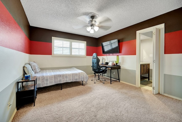4107 Crestgate Ave, Midland, TX 79707 - bedroom with carpet floors, an office area, a textured ceiling, ensuite bathroom, and a ceiling fan