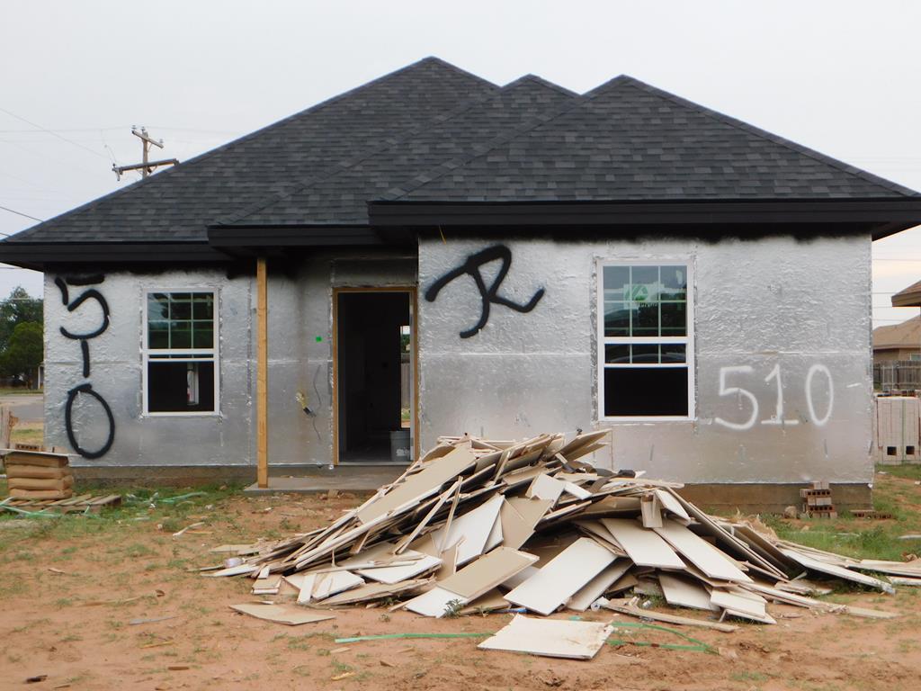 510 S Mineola St, Midland, TX 79701 - back of property featuring a shingled roof and stucco siding