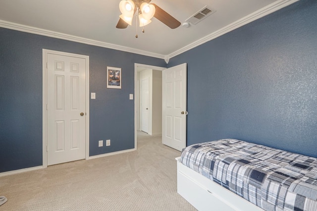 bedroom with baseboards, visible vents, ornamental molding, and carpet flooring