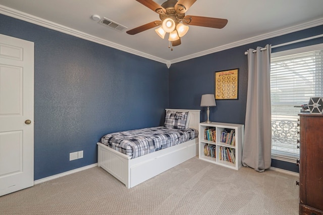 bedroom with carpet, visible vents, ornamental molding, a ceiling fan, and baseboards