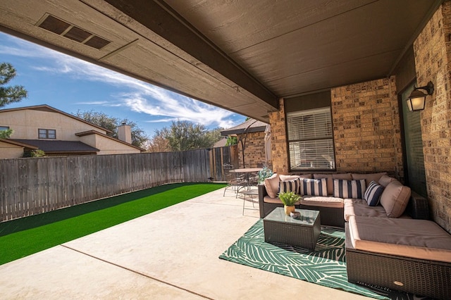 view of patio / terrace with a fenced backyard and an outdoor hangout area