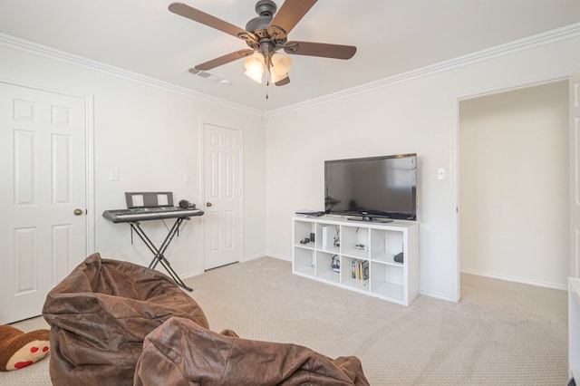 living area featuring a ceiling fan, visible vents, baseboards, ornamental molding, and carpet