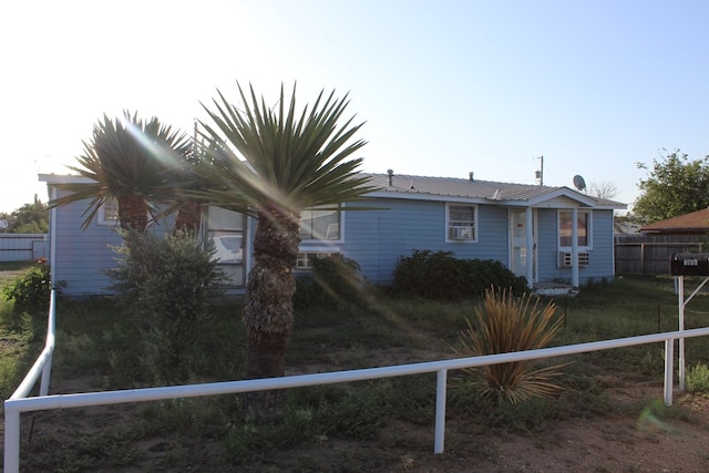 back of house featuring cooling unit