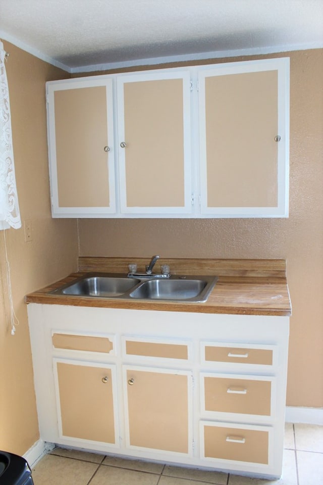 bathroom featuring tile patterned floors and sink