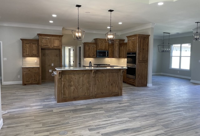 kitchen with light wood-type flooring, baseboards, tasteful backsplash, and brown cabinetry