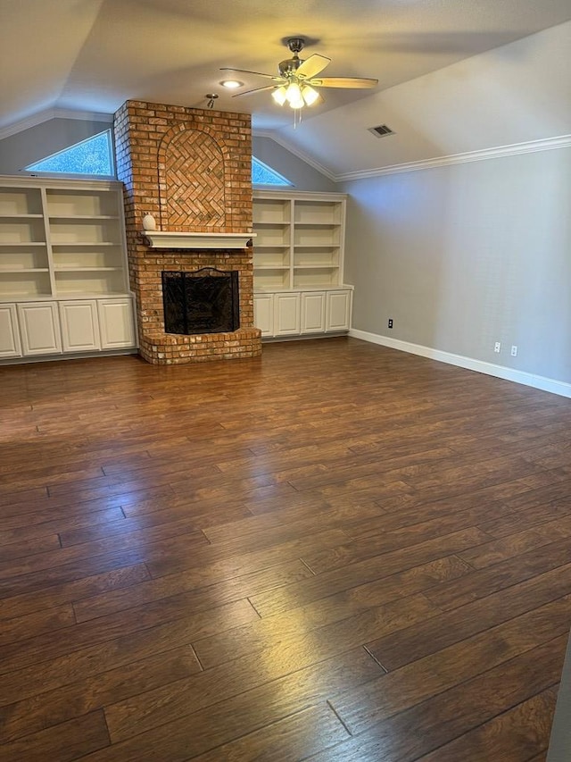 unfurnished living room with lofted ceiling, ceiling fan, a brick fireplace, and dark hardwood / wood-style flooring