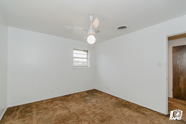 carpeted empty room featuring ceiling fan