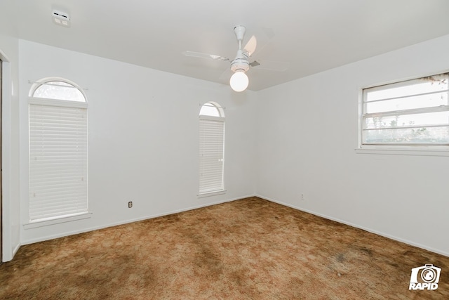 unfurnished room featuring carpet floors and ceiling fan