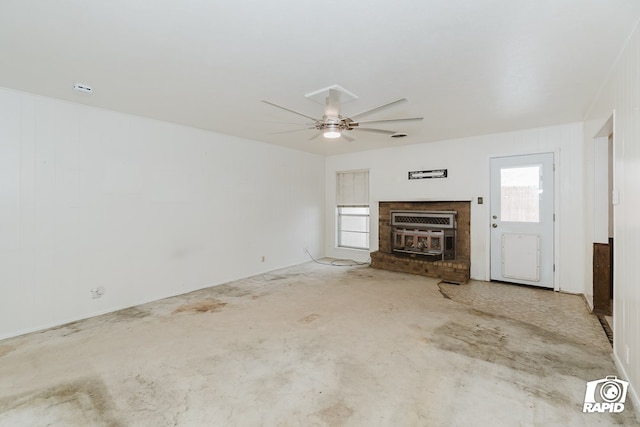 unfurnished living room with ceiling fan