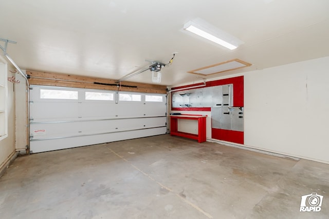 garage with electric panel and a garage door opener