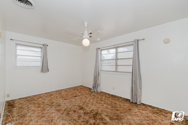 unfurnished room featuring carpet and ceiling fan