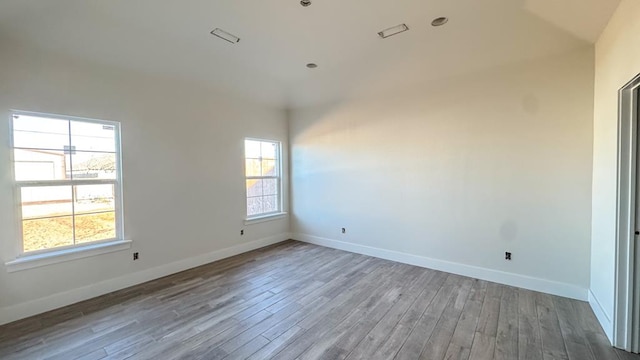 unfurnished room with plenty of natural light and light wood-type flooring