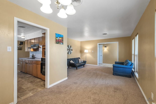 living area featuring light carpet, visible vents, and baseboards