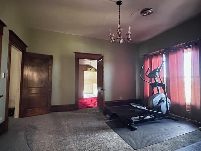 2311 30th St, Snyder, TX 79549 - workout area with carpet floors and a chandelier