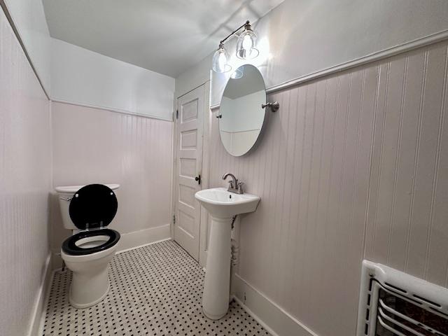 2311 30th St, Snyder, TX 79549 - bathroom featuring toilet and a sink