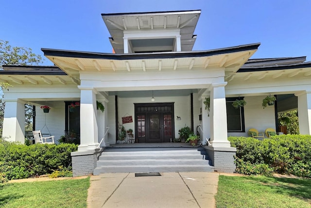 entrance to property with covered porch