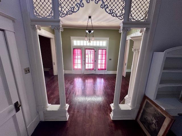 2311 30th St, Snyder, TX 79549 - foyer entrance with wood finished floors, ornamental molding, and ornate columns