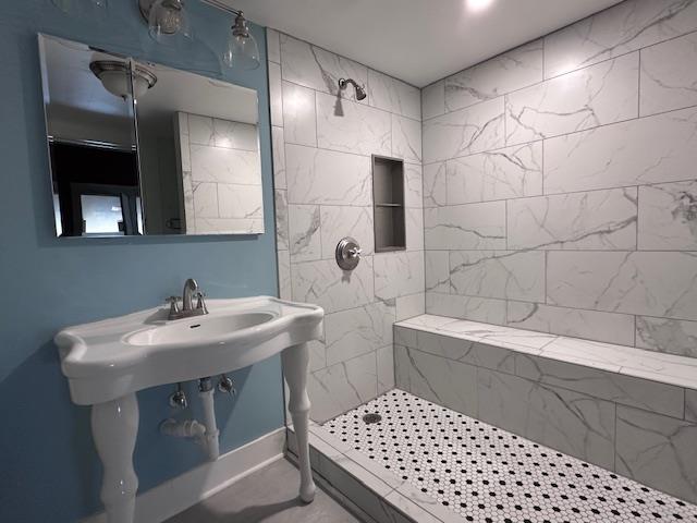 2311 30th St, Snyder, TX 79549 - full bathroom featuring a tile shower