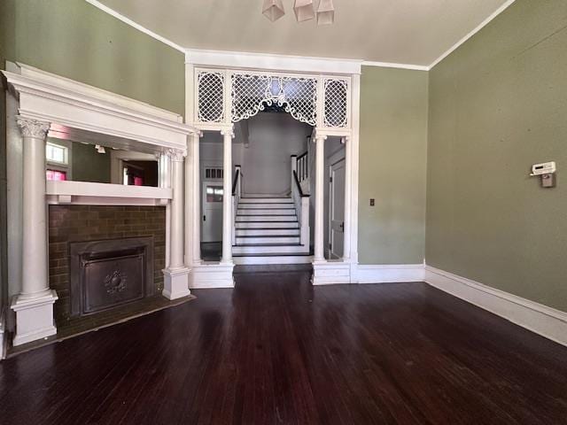 unfurnished living room with a fireplace, hardwood / wood-style floors, and ornamental molding