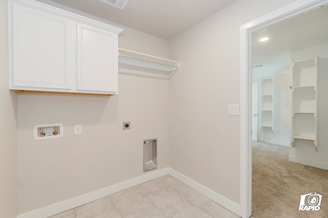 laundry area featuring cabinets, hookup for a washing machine, light carpet, and electric dryer hookup