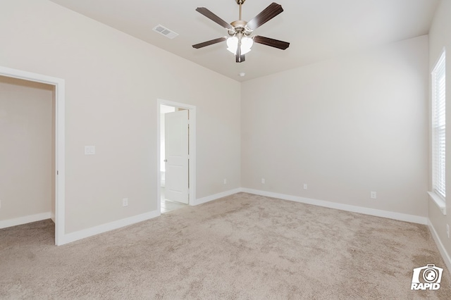 empty room with light carpet and ceiling fan