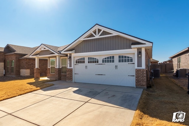 craftsman house featuring central AC and a garage