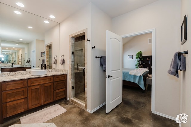 full bathroom with concrete flooring, a shower stall, ensuite bathroom, vanity, and recessed lighting