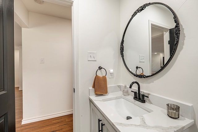 bathroom featuring wood-type flooring and vanity