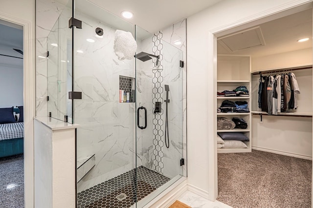 bathroom featuring a shower with door