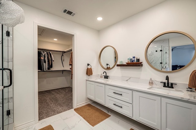 bathroom with an enclosed shower and vanity