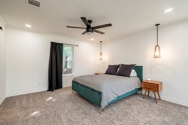 bedroom featuring ceiling fan, ornamental molding, and carpet floors