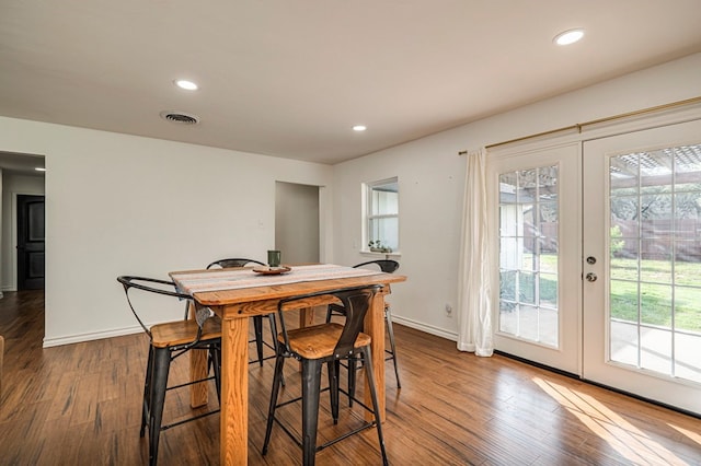 dining room featuring french doors and hardwood / wood-style flooring