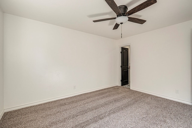 empty room featuring ceiling fan and carpet floors