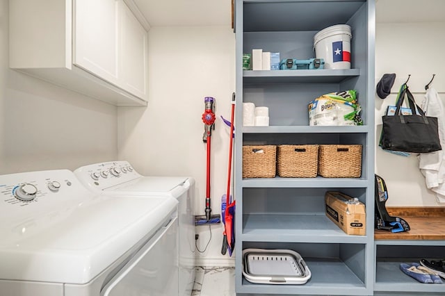 laundry area with cabinets and independent washer and dryer