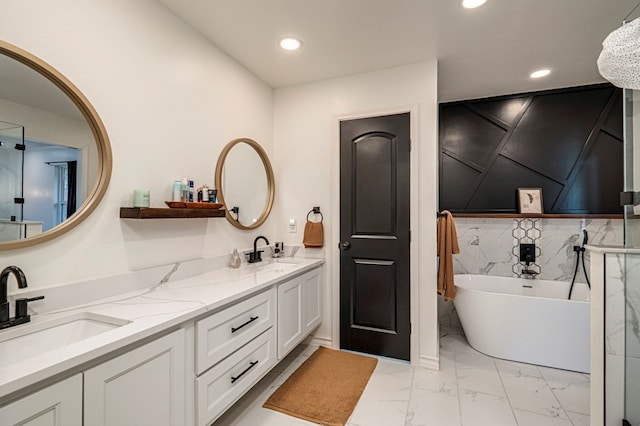 bathroom with vanity and a bathing tub