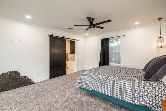 bedroom with ceiling fan, carpet, a barn door, and ornamental molding