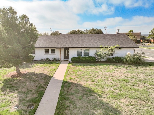 ranch-style house with a front yard