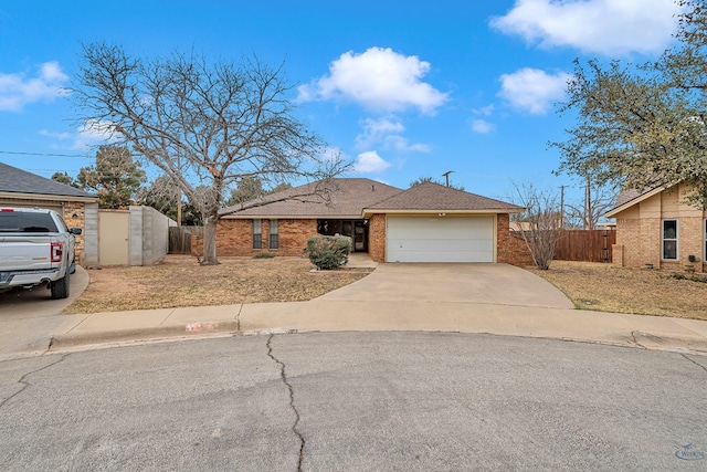 single story home featuring roof with shingles, brick siding, fence, a garage, and driveway