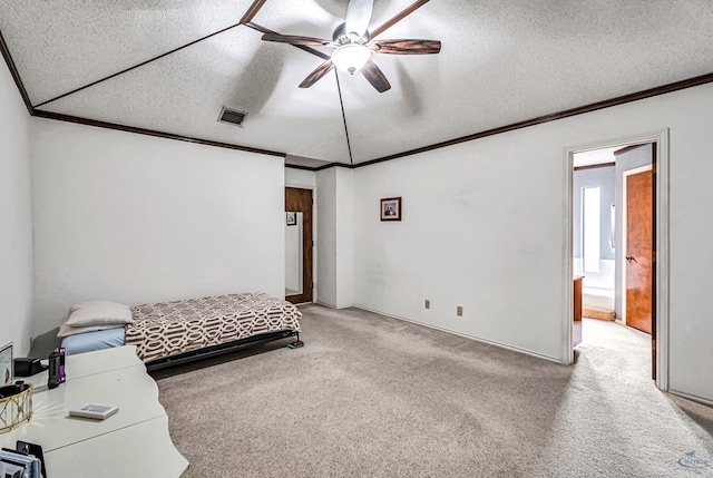 carpeted bedroom with crown molding, visible vents, and a textured ceiling